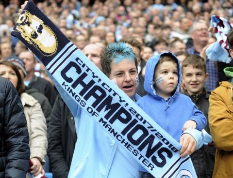 Manchester City fans watch the English Premier League soccer match between Manchester City and Swansea City at Etihad stadium in Manchester, England, Sunday, April 22, 2018. (AP Photo/Rui Vieira)