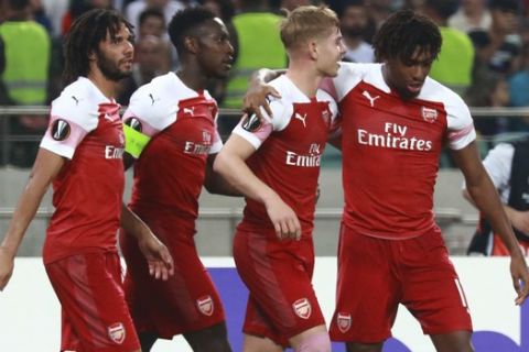 Arsenal's Emile Smith Rowe, second right, celebrate with teammates after scoring his side's second goal during a Group E Europa League soccer match between Qarabag FK and Arsenal at the Olympic stadium in Baku, Azerbaijan, Thursday, Oct. 4, 2018. (AP Photo/Aziz Karimov)