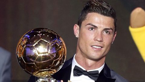 Real Madrid's Christiano Ronaldo of Portugal holds the trophy for world player of the year at the FIFA Ballon d'Or 2013 Gala in Zurich, Switzerland, Monday, Jan. 13, 2014. (AP Photo/Michael Probst)