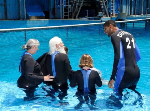 SAN ANTONIO - AUGUST 9:  San Antonio Spurs Tim Duncan (R) was joined by Spurs season ticket holders Gloria and Wil Drash (L-R) for a Swim with Tim and Beluga whales event auctioned off during the Spurs annual Tux-N-Tennies Dinner at SeaWorld San Antonio  on August 9, 2010, in San Antonio, Texas. NOTE TO USER: User expressly acknowledges and agrees that, by downloading and/or using this photograph, User is consenting to the terms and conditions of the Getty Images License Agreement. Mandatory Copyright Notice: Copyright 2010 NBAE (Photo by D. Clarke Evans/NBAE via Getty Images) *** Local Caption *** Tim Duncan;Gloria Drash;Wil Drash