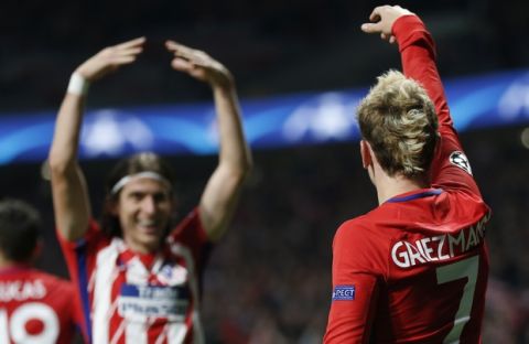 Atletico's Antoine Griezmann celebrates with Filipe Luis scoring the opening goal during a Champions League group C soccer match between Atletico Madrid and Roma at the Wanda Metropolitano stadium in Madrid, Wednesday, Nov. 22, 2017. (AP Photo/Francisco Seco)
