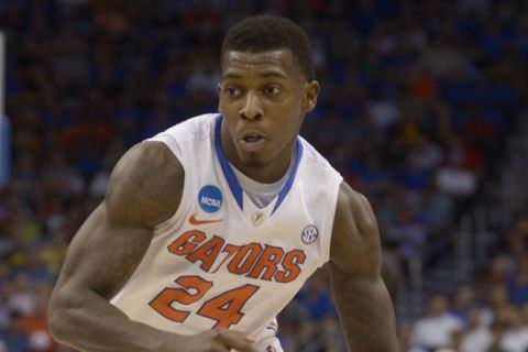 Florida forward Casey Prather (24) dribbles the ball against Albany in the first half in a second-round game in the NCAA college basketball tournament Thursday, March 20, 2014, in Orlando, Fla. (AP Photo/Phelan M. Ebenhack)