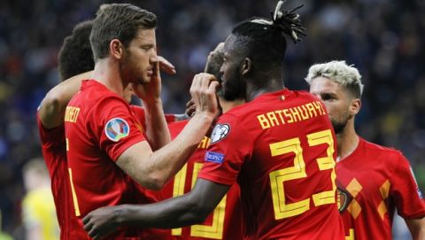 Belgium's Michy Batshuayi, second right, celebrates with his teammates after scoring the opening goal during the Euro 2020 group I qualifying soccer match between Kazakhstan and Belgium at the Astana Arena stadium in Nur-Sultan, Kazakhstan, Sunday, Oct. 13, 2019. (AP Photo)