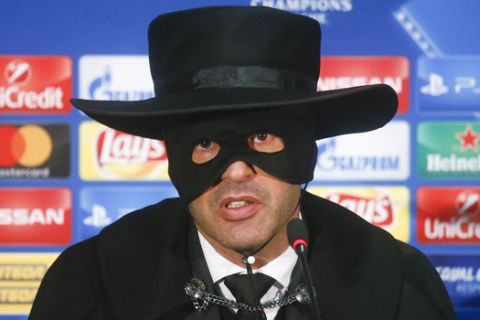 Shakthtar coach Paulo Fonseca, dressed as Zorro attends a press conference after victory for his team in the Champions League group F soccer match between Manchester City and Shakhtar Donetsk at the Metalist Stadium in Kharkiv, Ukraine, Wednesday, Dec. 6, 2017. (AP Photo/Efrem Lukatsky)