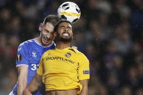 Rangers' Nikola Katic, left, jumps for the ball with Young Boys' Saidy Janko during the Europa League group G soccer match between Rangers and Young Boys at the Ibrox stadium in Glasgow, Scotland, Thursday, Dec. 12, 2019. (AP Photo/Scott Heppell)