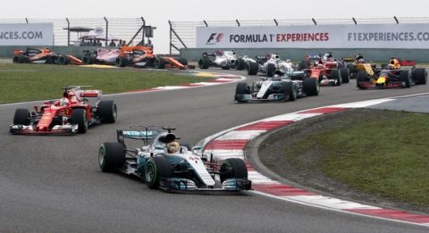 Mercedes driver Lewis Hamilton of Britain (44) leads the field in the first lap of the Chinese Formula One Grand Prix at the Shanghai International Circuit in Shanghai, China, Sunday, April 9, 2017. (AP Photo/Toru Takahashi)