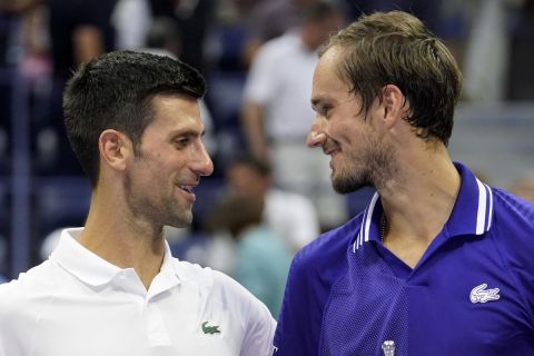 Novak Djokovic, of Serbia, left, and Daniil Medvedev, of Russia, talk during the trophy ceremony after the men's singles final of the US Open tennis championships, Sunday, Sept. 12, 2021, in New York. (AP Photo/John Minchillo)