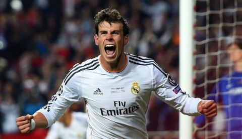 LISBON, PORTUGAL - MAY 24:  Gareth Bale of Real Madrid celebrates scoring their second goal in extra time during the UEFA Champions League Final between Real Madrid and Atletico de Madrid at Estadio da Luz on May 24, 2014 in Lisbon, Portugal.  (Photo by Shaun Botterill/Getty Images)