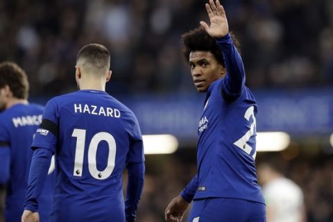 Chelsea's Willian celebrates after scoring the opening goal during the English Premier League soccer match between Chelsea and Crystal Palace at Stamford Bridge stadium in London, Saturday, March 10, 2018. (AP Photo/Matt Dunham)