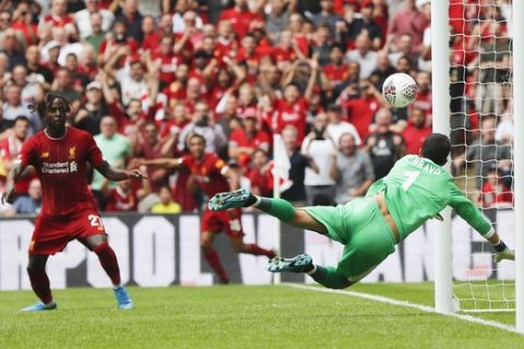 Manchester City's goalkeeper Claudio Bravo dives as the ball comes off the underside of the crossbar during the Community Shield soccer match between Manchester City and Liverpool at Wembley Stadium in London, Sunday, Aug. 4, 2019. (AP Photo/Frank Augstein)