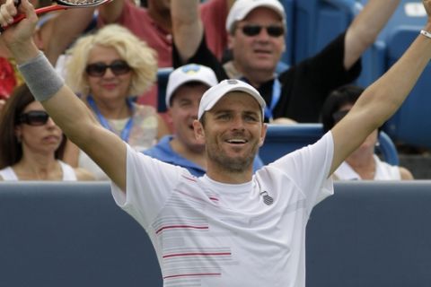 Mardy Fish celebrates after he defeated Rafael Nadal, from Spain, 6-3, 6-4, in a quarterfinal match at the Western & Southern Open tennis tournament, Friday, Aug. 19, 2011 in Mason, Ohio. (AP Photo/Al Behrman)