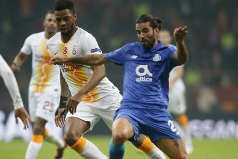 Porto midfielder Sergio Oliveira, right, fights for the ball with Galatasaray midfielder Ryan Don during the Champions League Group D soccer match between Galatasaray and Porto in Istanbul, Tuesday, Dec. 11, 2018. (AP Photo/Lefteris Pitarakis)