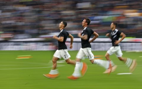 Juventus' Cristiano Ronaldo, left, warms up with his teammates prior to the start of the Serie A soccer match between AC Udinese and Juventus at the Dacia Arena Stadium, in Udine, Italy, Saturday, Oct. 6, 2018. (AP Photo/Antonio Calanni)