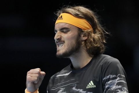 Stefanos Tsitsipas of Greece celebrates after winning a point against Austria's Dominic Thiem during their ATP World Finals singles final tennis match at the O2 arena in London, Sunday, Nov. 17, 2019. (AP Photo/Kirsty Wigglesworth)