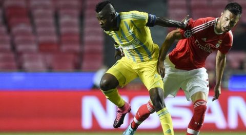 Astana's Central African midfielder Foxi Kethevoama (L) vies with Benfica's Greek midfielder Andreas Samaris (R) during the UEFA Champions League football match SL Benfica vs FC Astana at the Luz stadium in Lisbon on September 15, 2015. AFP PHOTO / FRANCISCO LEONG        (Photo credit should read FRANCISCO LEONG/AFP/Getty Images)