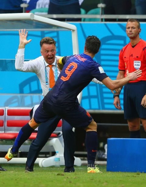 SALVADOR, BRAZIL - JUNE 13:  Robin van Persie of the Netherlands celebrates with head coach Louis van Gaal after scoring the teams first goal in the first half during the 2014 FIFA World Cup Brazil Group B match between Spain and Netherlands at Arena Fonte Nova on June 13, 2014 in Salvador, Brazil.  (Photo by Dean Mouhtaropoulos/Getty Images)