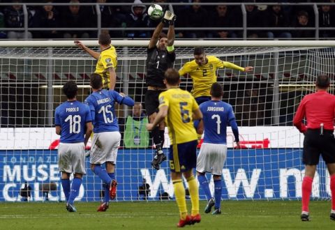 Italy goalkeeper Gianluigi Buffon reaches for the ball during the World Cup qualifying play-off second leg soccer match between Italy and Sweden, at the Milan San Siro stadium, Italy, Monday, Nov. 13, 2017. (AP Photo/Antonio Calanni)
