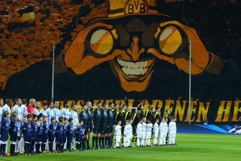 DORTMUND, GERMANY - APRIL 09:  The Malaga and Borussia Dortmund teams line up ahead of the UEFA Champions League quarter-final second leg match between Borussia Dortmund and Malaga at Signal Iduna Park on April 9, 2013 in Dortmund, Germany.  (Photo by Alex Grimm/Bongarts/Getty Images)