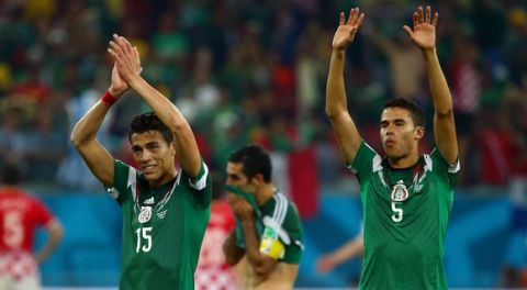 RECIFE, BRAZIL - JUNE 23:  Hector Moreno and Diego Reyes of Mexico acknowledge the fans after a 3-1 victory in the 2014 FIFA World Cup Brazil Group A match between Croatia and Mexico at Arena Pernambuco on June 23, 2014 in Recife, Brazil.  (Photo by Robert Cianflone/Getty Images)