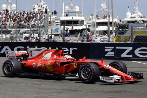 Ferrari driver Sebastian Vettel of Germany steers his car during the qualification at the Formula One Grand Prix at the Monaco racetrack in Monaco, Saturday, May 27, 2017. The Formula 1 Grand Prix of Monaco race will take place on Sunday May 28. (AP Photo/Claude Paris)