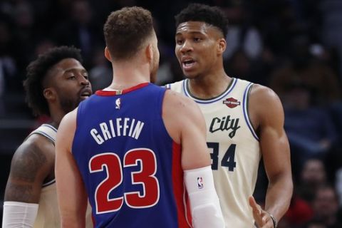Detroit Pistons forward Blake Griffin (23) and Milwaukee Bucks forward Giannis Antetokounmpo (34) exchange words after a foul on the floor during the first half of an NBA basketball game, Wednesday, Dec. 4, 2019, in Detroit. (AP Photo/Carlos Osorio)