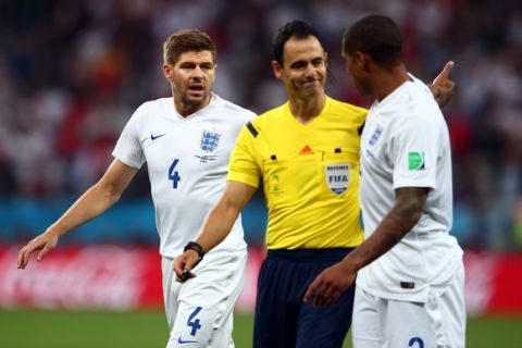 SAO PAULO, BRAZIL - JUNE 19:  Steven Gerrard of England reacts as referee Carlos Velasco Carballo speaks with Glen Johnson of England during the 2014 FIFA World Cup Brazil Group D match between Uruguay and England at Arena de Sao Paulo on June 19, 2014 in Sao Paulo, Brazil.  (Photo by Julian Finney/Getty Images)
