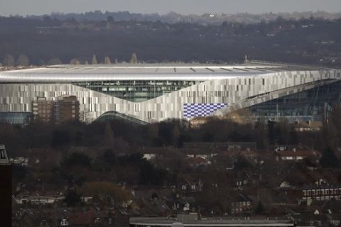 FILE - In this Feb. 20, 2019, file photo, the new Tottenham Hotspur stadium in north London is viewed. Tottenham will play the first soccer game in its new stadium in April. Spurs were due to move into the 62,000-seat stadium in September, but construction delays forced them to continue playing at their temporary home in Wembley. (AP Photo/Matt Dunham, File)