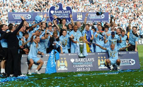Manchester City players celebrate with the Premier League trophy after their 3-2 victory over Queens Park Rangers in the English Premier League football match between Manchester City and Queens Park Rangers at The Etihad stadium in Manchester, north-west England on May 13, 2012. Manchester City won the game 3-2 to secure their first title since 1968. This is the first time that the Premier league title has been decided on goal-difference, Manchester City and Manchester United both finishing on 89 points. AFP PHOTO/PAUL ELLIS

RESTRICTED TO EDITORIAL USE. No use with unauthorized audio, video, data, fixture lists, club/league logos or 'live' services. Online in-match use limited to 45 images, no video emulation. No use in betting, games or single club/league/player publications.PAUL ELLIS/AFP/GettyImages