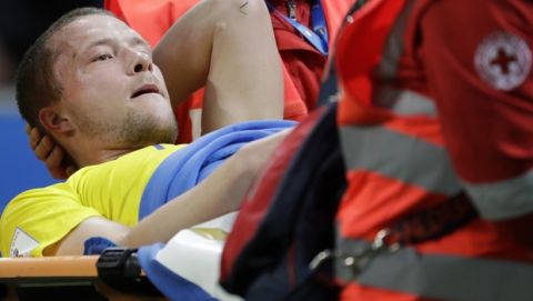 Sweden's Ludwig Augustinsson is carried off the pitch after sustaining an injury during the World Cup qualifying play-off second leg soccer match between Italy and Sweden, at the Milan San Siro stadium, Italy, Monday, Nov. 13, 2017. (AP Photo/Luca Bruno)