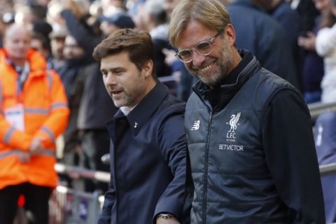 head coach Mauricio Pochettino , left, and Liverpool head coach Juergen Klopp prior to the English Premier League soccer match between Tottenham Hotspur and Liverpool at Wembley Stadium in London, Sunday, Oct. 22, 2017.(AP Photo/Frank Augstein)