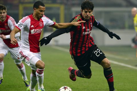 AC Milan's Brazilian forward Kaka (R) fights for the ball with Ajax's defender Ricardo van Rhijn during the group H Champions League football match AC Milan vs Ajax, on December 11, 2013 in San Siro Stadium..AFP PHOTO / OLIVIER MORIN        (Photo credit should read OLIVIER MORIN/AFP/Getty Images)