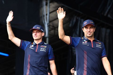 SINGAPORE, SINGAPORE - SEPTEMBER 16: Max Verstappen of the Netherlands and Oracle Red Bull Racing and Sergio Perez of Mexico and Oracle Red Bull Racing wave to the crowd on the fan stage prior to final practice ahead of the F1 Grand Prix of Singapore at Marina Bay Street Circuit on September 16, 2023 in Singapore, Singapore. (Photo by Mark Thompson/Getty Images) // Getty Images / Red Bull Content Pool // SI202309160186 // Usage for editorial use only //