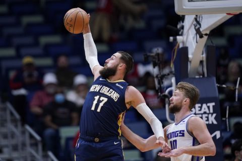New Orleans Pelicans center Jonas Valanciunas (17) pulls down rebound against Sacramento Kings forward Domantas Sabonis (10) in the first half of an NBA basketball game in New Orleans, Wednesday, March 2, 2022. (AP Photo/Gerald Herbert)