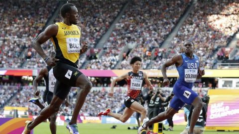 Jamaica's Usain Bolt, Japan's Shuhei Tada and United States' Christian Coleman, from left, cross the line of a men's 100-meter semifinal during the World Athletics Championships in London Saturday, Aug. 5, 2017. (AP Photo/Matt Dunham)
