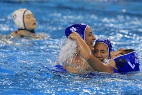 Greece players, in blue caps, celebrate their victory over China after a final match for the women's water polo at the FINA Swimming World Championships in Shanghai, China, Friday, July 29, 2011. (AP Photo/Eugene Hoshiko)