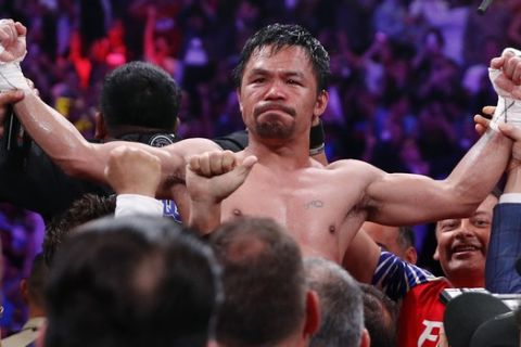 Manny Pacquiao reacts after defeating Keith Thurman by split decision in a welterweight title fight Saturday, July 20, 2019, in Las Vegas. (AP Photo/John Locher)