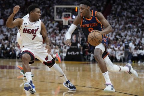 New York Knicks guard RJ Barrett (9) drives to the basket against Miami Heat guard Kyle Lowry (7) during the first half of Game 3 of an NBA basketball second-round playoff series, Saturday, May 6, 2023, in Miami. (AP Photo/Wilfredo Lee)
