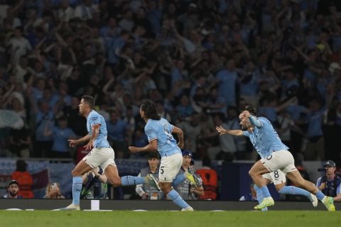 Manchester City's Rodrigo, left, celebrates after scoring his side's opening goal during the Champions League final soccer match between Manchester City and Inter Milan at the Ataturk Olympic Stadium in Istanbul, Turkey, Saturday, June 10, 2023. (AP Photo/Antonio Calanni)