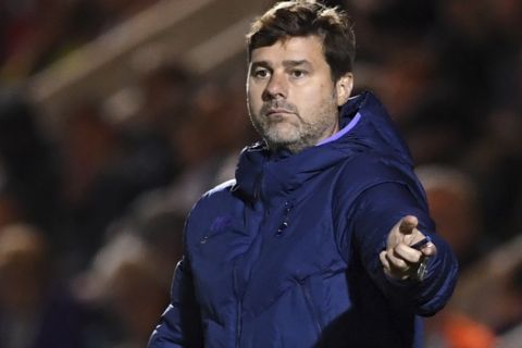 Tottenham Hotspur manager Mauricio Pochettino gestures during an English League Cup soccer match between Tottenham Hotspur and Colchester United, Tuesday, Sept. 24, 2019, at JobServe Community Stadium in Colchester, England. (Joe Giddens/PA via AP)