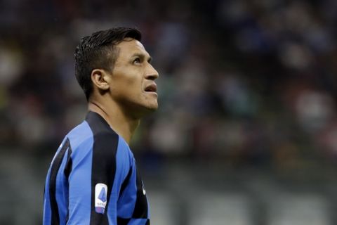 Inter Milan's Alexis Sanchez looks up during a Serie A soccer match between Inter Milan and Udinese, at the San Siro stadium in Milan, Italy, Saturday, Sept. 14, 2019. (AP Photo/Luca Bruno)