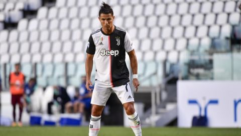 Juventus' Cristiano Ronaldo concentrates moments before scoring his side's thrid goal on a free-kick, during the Serie A soccer match between Juventus and Torino, at the Allianz Stadium in Turin, Italy, Saturday, July 4, 2020. (Marco Alpozzi/LaPresse via AP)