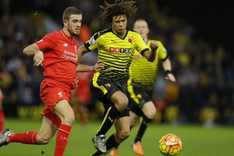 Watford's Nathan Ake, right, competes for the ball with Liverpool's Jordan Henderson during the English Premier League soccer match between Watford and Liverpool at Vicarage Road stadium in Watford, Sunday, Dec. 20, 2015. (AP Photo/Matt Dunham)