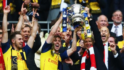 LONDON, ENGLAND - MAY 30:  Nacho Monreal of Arsenal and Arsene Wenger manager of Arsenal
lift the winners trophy following the FA Cup Final between Aston Villa and Arsenal at Wembley Stadium on May 30, 2015 in London, England.  (Photo by Paul Gilham/Getty Images)