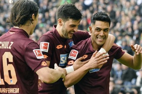 Hoffenheim's Nadiem Amiri, right, is celebrated after scoring his side's second goal during the German Bundesliga soccer match between Borussia Moenchengladbach and TSG 1899 Hoffenheim in Moenchengladbach, Germany, Saturday, May 4, 2019. (AP Photo/Martin Meissner)