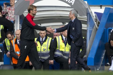 Chelsea's head coach Jose Mourinho, right, shakes hands with Liverpool's head coach Juergen Klopp after the final whistle of the English Premier League soccer match between Chelsea and Liverpool at Stamford Bridge stadium in London, Saturday, Oct. 31, 2015. Chelsea were defeated 3-1. (AP Photo/Matt Dunham)