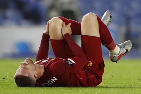 Liverpool's Jordan Henderson reacts during the English Premier League soccer match between Brighton and Liverpool at Falmer Stadium in Brighton, England, Wednesday, July 8, 2020. (AP Photo/Paul Childs,Pool)