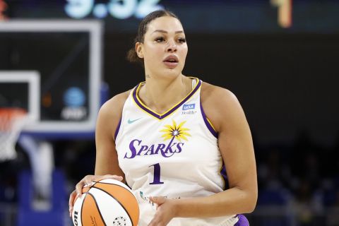 Los Angeles Sparks center Liz Cambage brings the ball up court against the Chicago Sky during the first half of the WNBA basketball game, Friday, May 6, 2022, in Chicago. (AP Photo/Kamil Krzaczynski)
