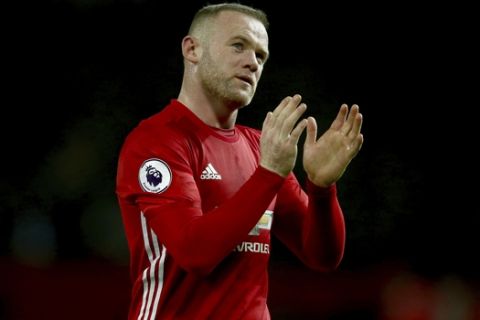 FILE - In this Sunday, Jan. 15, 2017 file photo, Manchester United's Wayne Rooney leaves the field after the English Premier League soccer match between Manchester United and Liverpool at Old Trafford stadium in Manchester, England. Wayne Rooney has left Manchester United to rejoin Everton after 13 years at Old Trafford, it was announced on Sunday, July 9, 2017. Everton says Rooney signed a two-year contract. (AP Photo/Dave Thompson, file)