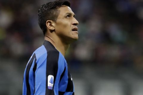 Inter Milan's Alexis Sanchez looks up during a Serie A soccer match between Inter Milan and Udinese, at the San Siro stadium in Milan, Italy, Saturday, Sept. 14, 2019. (AP Photo/Luca Bruno)