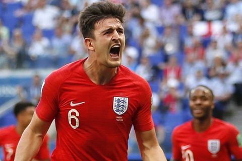 England's Harry Maguire celebrates after scoring his side opening goal during the quarterfinal match between Sweden and England at the 2018 soccer World Cup in the Samara Arena, in Samara, Russia, Saturday, July 7, 2018. (AP Photo/Francisco Seco)